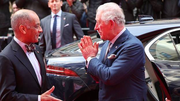 The Prince of Wales greets Sir Kenneth Olisa, The Lord-Lieutenant of Greater London (left) with a Namaste gesture at the annual Prince's Trust Awards 2020.